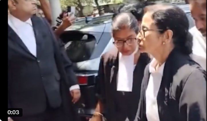 Mamata Banerjee, clad in a lawyer's gown, arrived at the Calcutta High Court to argue the post-poll violence case.