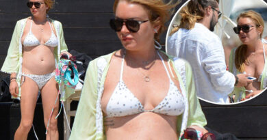 Hollywood actress Lindsay Lohan flaunts baby bump in swimsuit